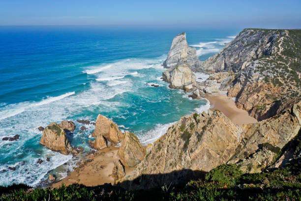 Ocean meets Cliffs of Cabo da Roca Cape Roca in Sintra - the westernmost extent of mainland Portugal and Europe stock photo