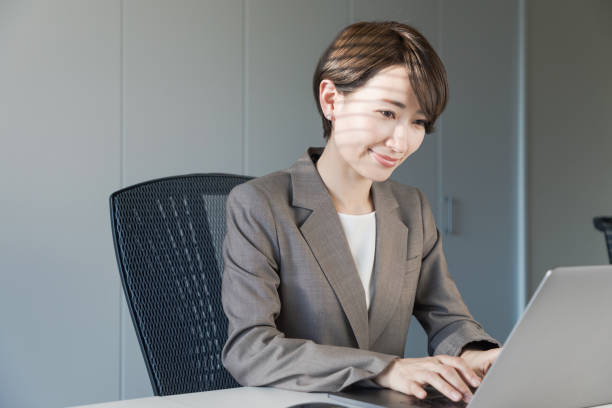 istock Middle aged woman working in the office. 943327252