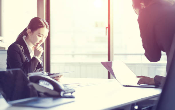 istock Three businesswomen working in the office. Positive workplace concept. 943327420