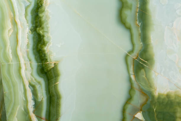 istock Elegant natural onyx background in light green tone 943330382