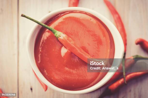 Red Hot Chilli Sauce In White Ceramic Bowl Stock Photo - Download Image Now - Sriracha Tiger Zoo, Chili Con Carne, Chili Sauce
