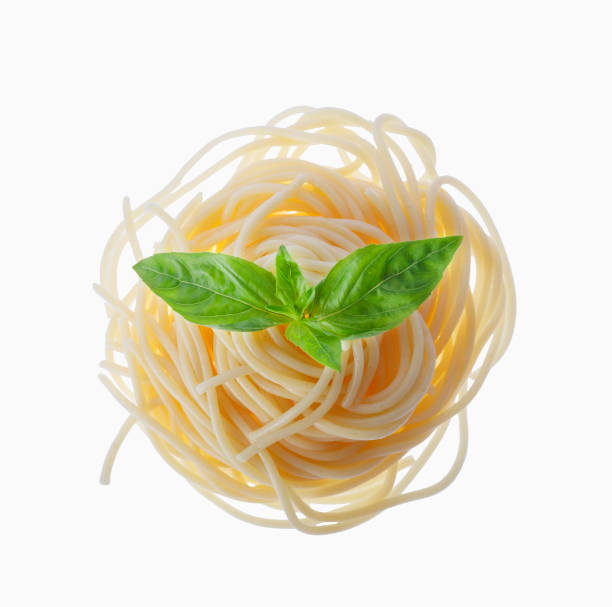 istock Italian cook, spaghetti, pasta, basil, isolated, white backgroun 943342354