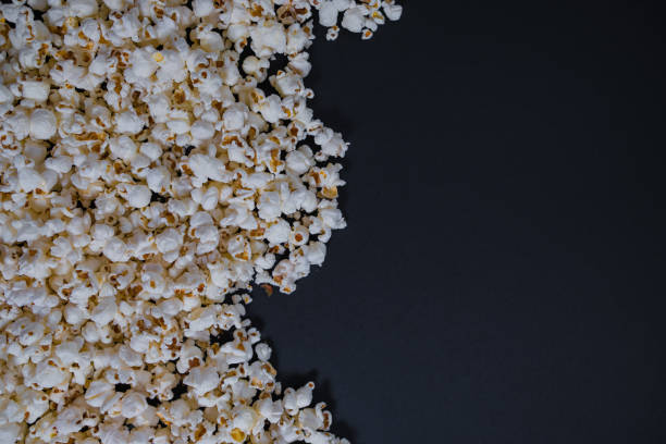 istock Scattered salted popcorn, texture background. Clipping path included 943342798