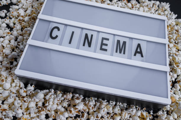 istock Popcorn border on black with words Cinema 943345536