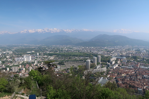 Grenoble, France – April 07, 2017: photography showing the skyline of the city of Grenoble. The photography was taken from the Bastille which is the name of the hill overlooking the city of Grenoble.
