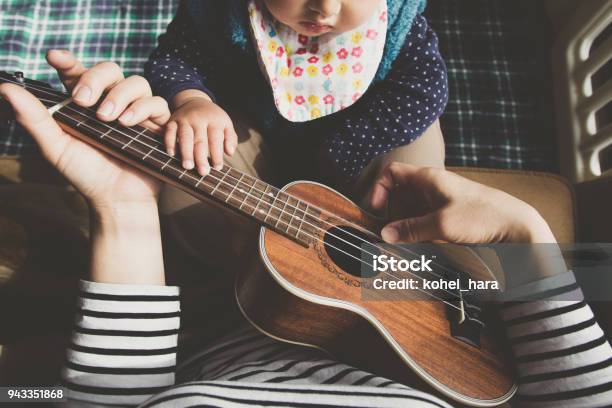 Mother And Baby Playing Ukulele At Home Stock Photo - Download Image Now - Point of View, Baby - Human Age, Music