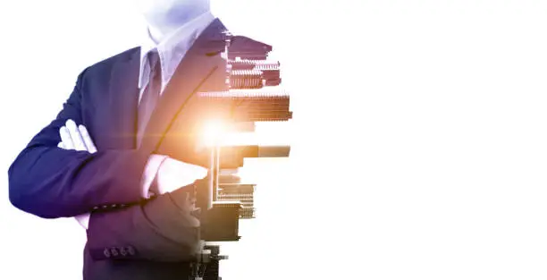 Photo of Double exposure businessman stand confident with city and sunrise on white background