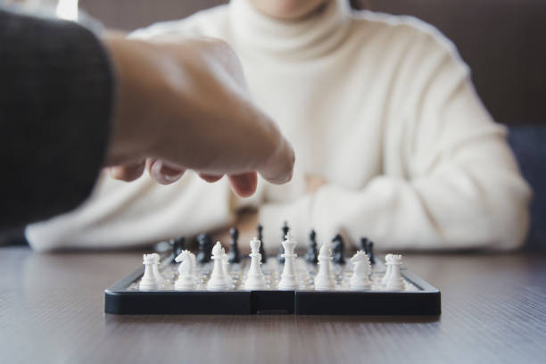 istock Man and woman playing chess 943352022