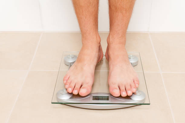 istock man only foot on slale in bathroom 943358336