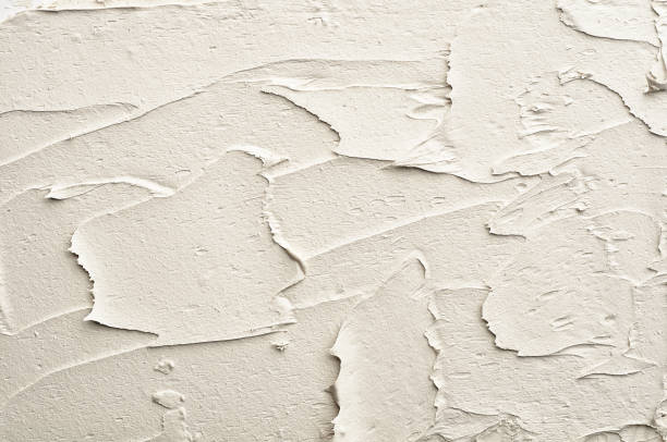 istock white and gray abstract painting. Texture of putty plaster 943359272