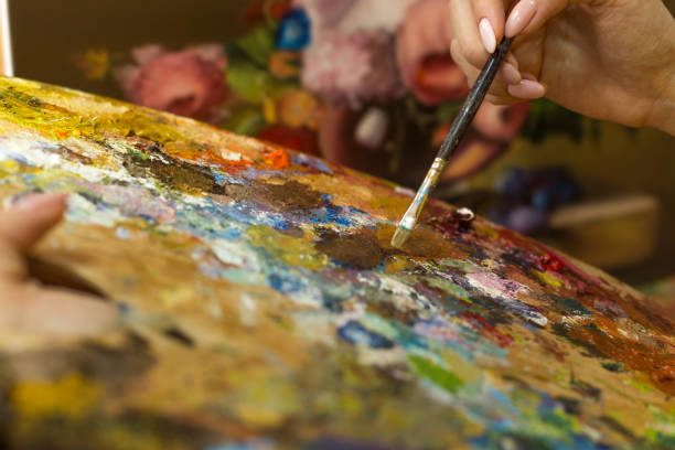 istock Young woman painting 943360000
