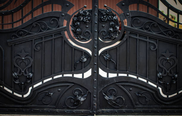 istock wrought-iron gates, ornamental forging, forged elements close-up 943365074