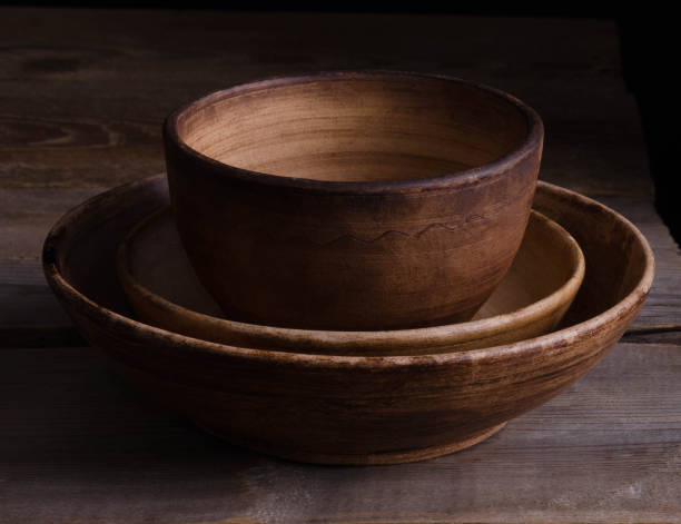 istock clay dishes on an old wooden table 943369278