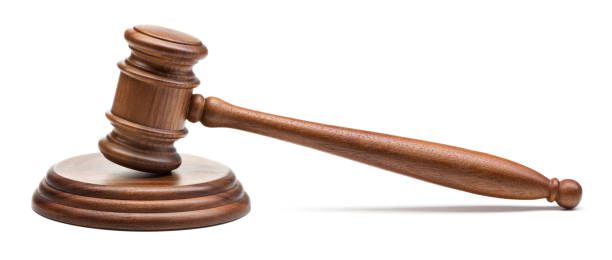 istock single wooden judge gavel isolated on white background 943372266