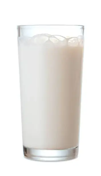 Photo of single glass of fresh milk isolated on white background