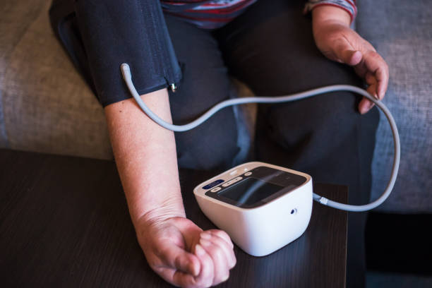 istock Senior woman measures pressure at home 943378538
