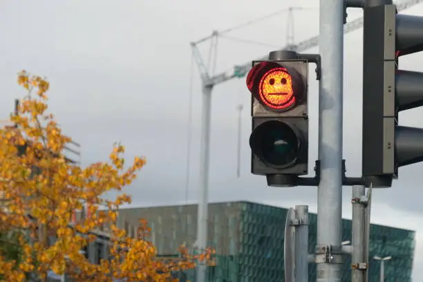 Photo of Sad faced red light at a pedestrian crossing