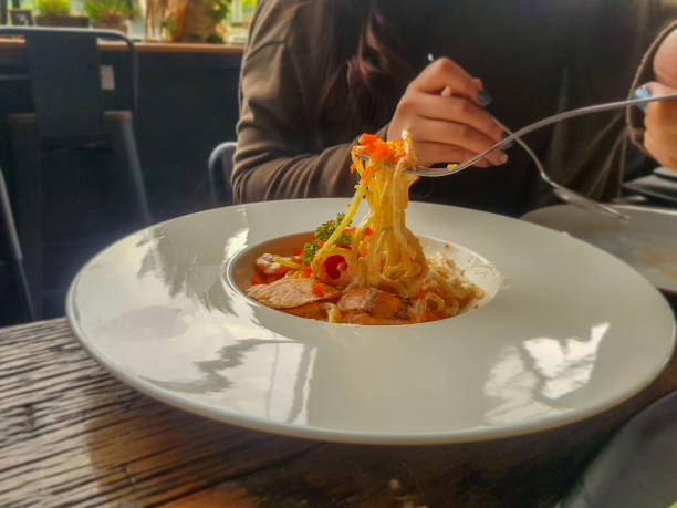 istock spaghetti salmon with egg shrimp in big white dish. 943387500