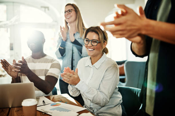 istock Smiling group of diverse office colleagues clapping during a meeting 943387576