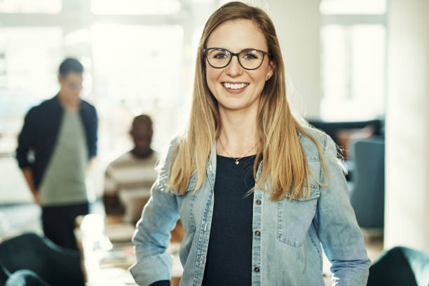 istock Smiling young designer at work in a modern office 943387980