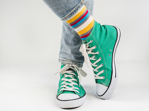 istock Stylish sneakers and funny, happy socks 943393734