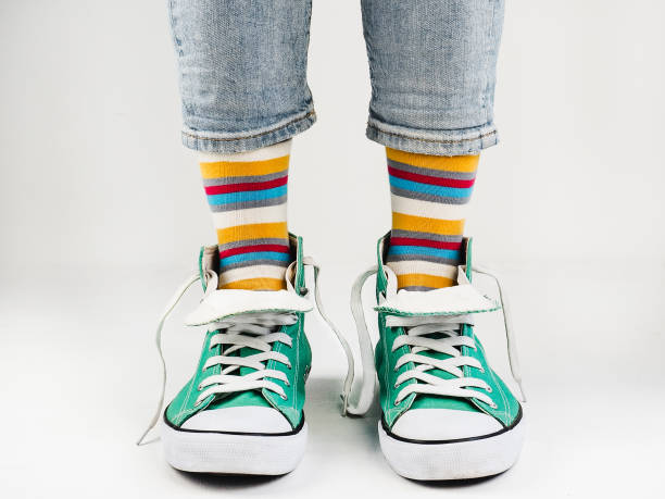 istock Stylish sneakers and funny, happy socks 943393772