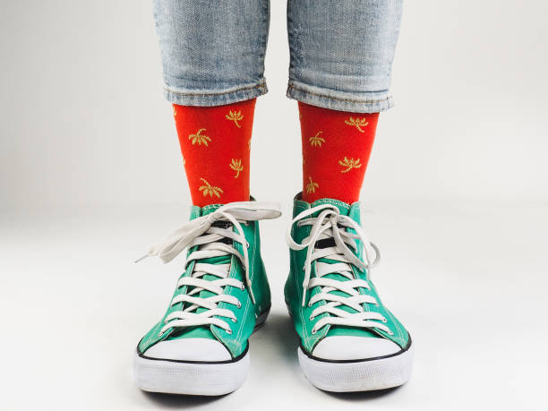 istock Stylish sneakers and funny, happy socks 943393814