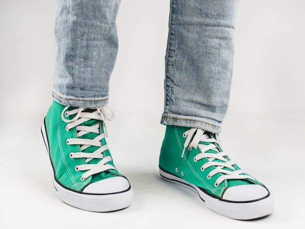 istock Stylish sneakers and funny, happy socks 943393880