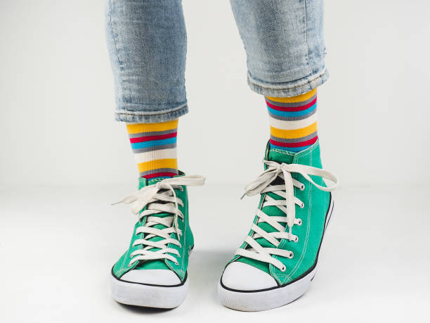 istock Stylish sneakers and funny, happy socks 943393998