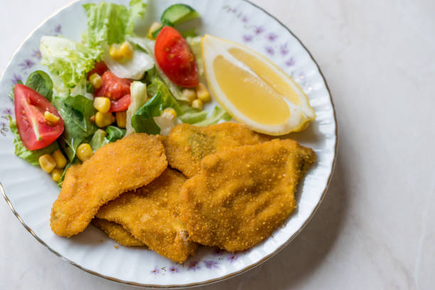 istock Fried Crispy Sardine Fish Plate with Salad and Lemon / Seafood Sardalya 943398148