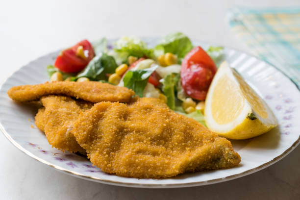 istock Fried Crispy Sardine Fish Plate with Salad and Lemon / Seafood Sardalya 943400372