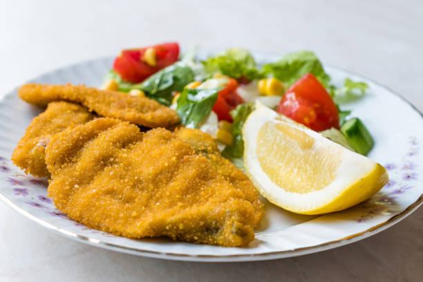 istock Fried Crispy Sardine Fish Plate with Salad and Lemon / Seafood Sardalya 943400808