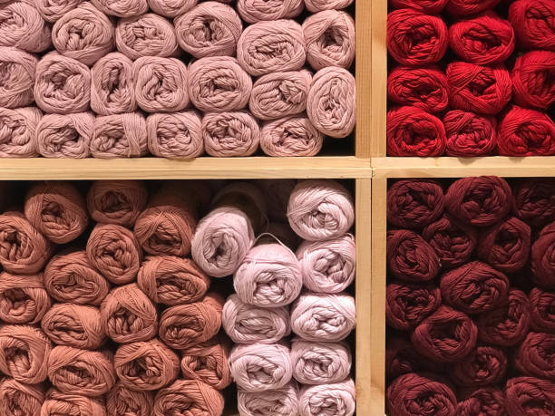 istock Wool in red colors on the shelf 943401024