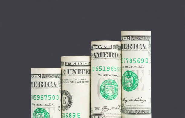 растущий бар график из банкнот доллара сша - us currency us paper currency currency currency symbol стоковые фото и изображения