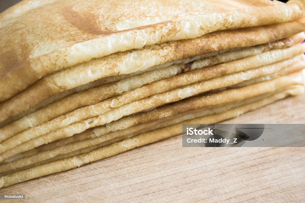 Close up of french crepes, thin pancakes on a wooden table Close up of french crepes, thin pancakes on a wooden table. Backgrounds Stock Photo