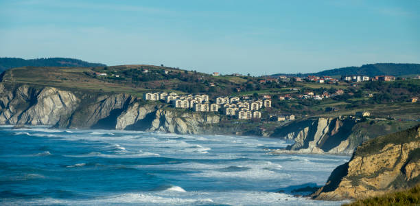 Sea waves near coast cliffs in Sopelana Sea waves near coast cliffs in Sopelana, Basque Country sopelana stock pictures, royalty-free photos & images