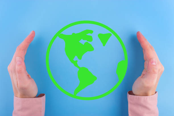 istock Woman hands holding earth. 943410460