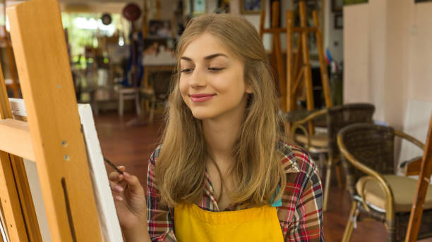 istock Young blond woman working 943411920