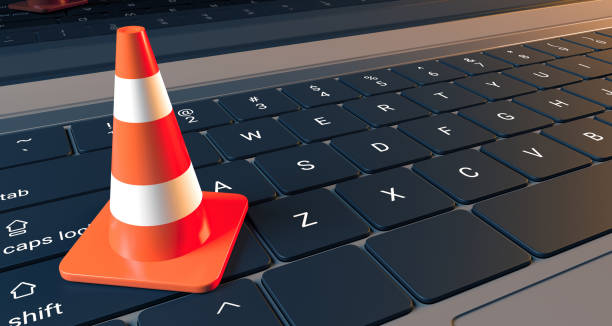 istock Realistic Laptop Keyboard Closeup With Traffic Cone 943414680