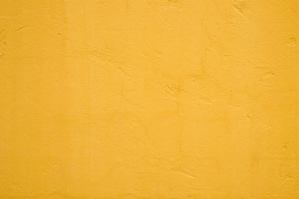 istock abstract yellow texture background concrete wall for design 943418474