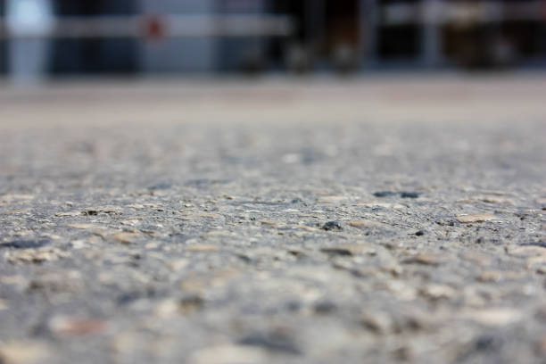 Remains of construction debris on street paved with paving stones in form of red brick fragments, mortar. Losses, damages in production, construction, transportation, loading, unloading. Efficiency.