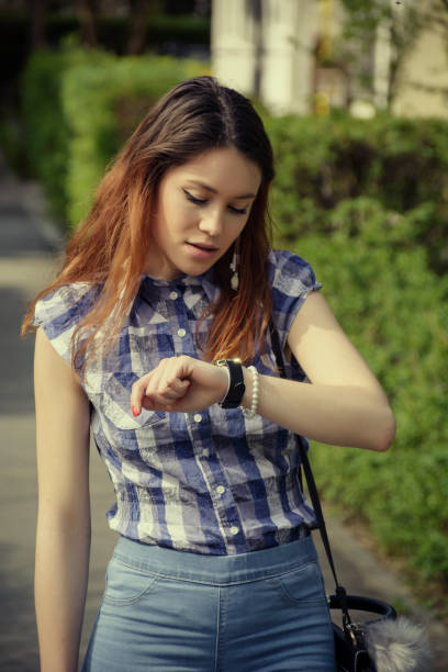 istock Young woman in a blue blouse in a spring day 943424796