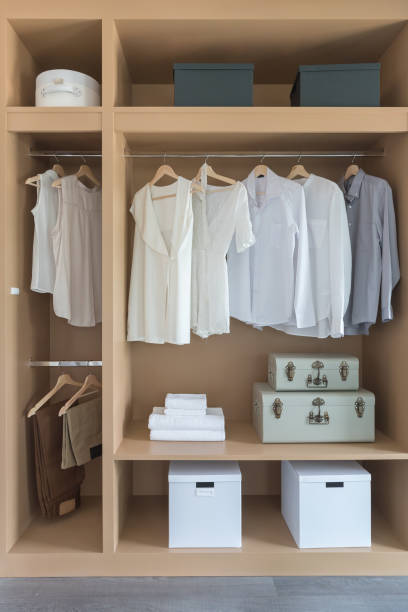 istock white color shirts hanging on rail 943431012