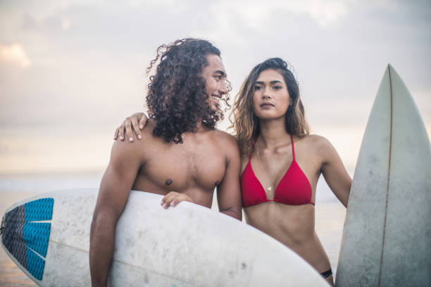 istock Young couple at the beach 943437474