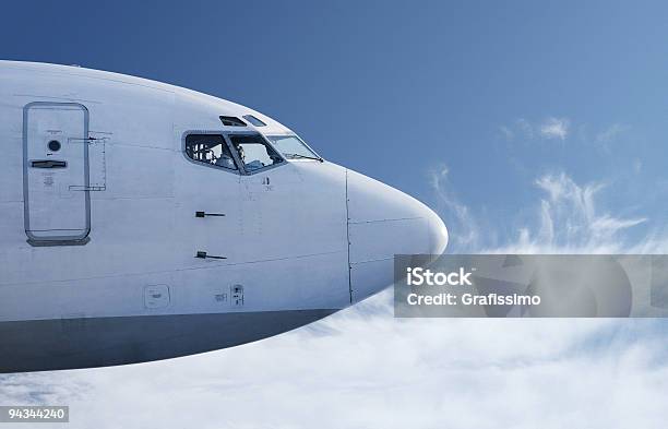 Airplane Flying In Front Of Blue Sky Stock Photo - Download Image Now - Airplane, Fuselage, Bird