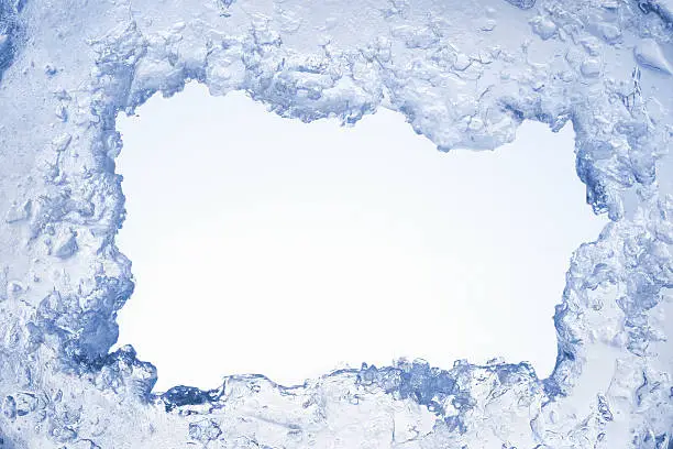 Photo of Blue ice framing blank pale blue background