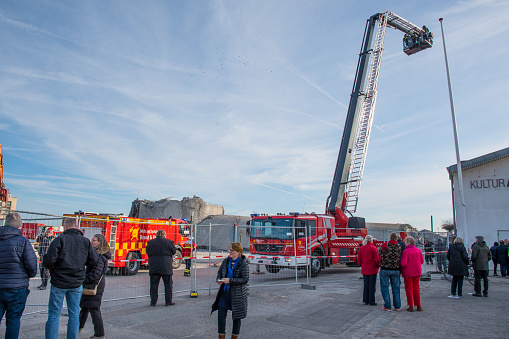 Vordingborg Denmark - April 6. 2018: fire trucks and people at a construction site after a failed blow down of a silo