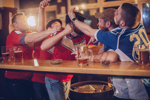 istock Group of men fighting in bar 943444230