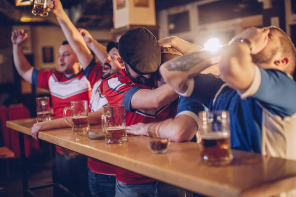 istock Happy and sad sport fans 943449476