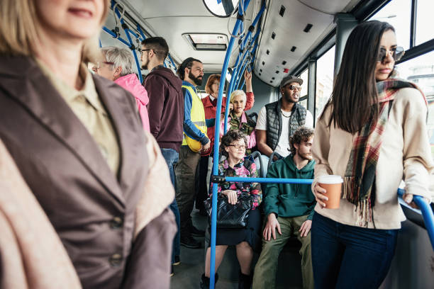 istock Students, professionals and seniors traveling by bus 943452256